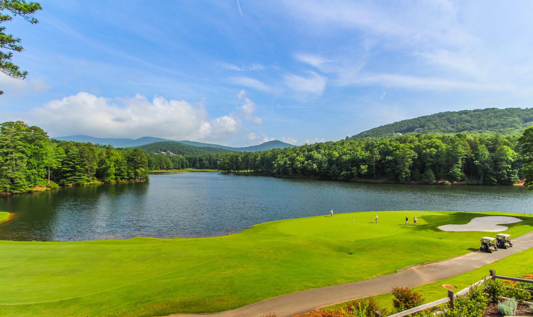 A serene view of the lake at VRI's Golf Club Villas in Marble Hill, Georgia.